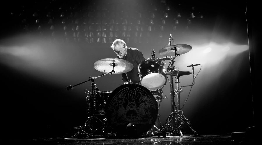 Roger Taylor Stood Behind Drum Kit