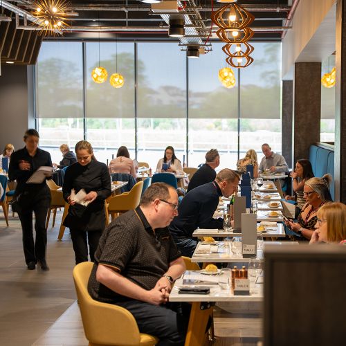 Guests dining in a premium hospitality restaurant